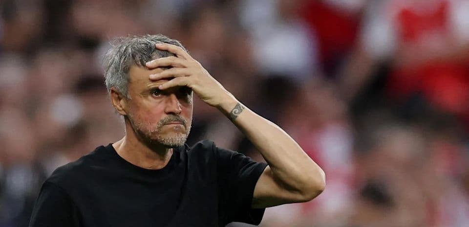 Coach looking concerned during a match