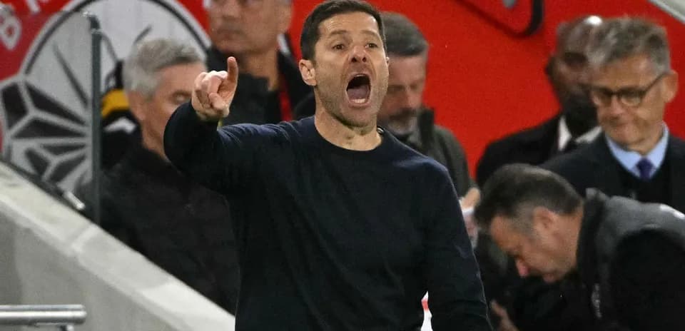 Coach gesturing and shouting from the sideline