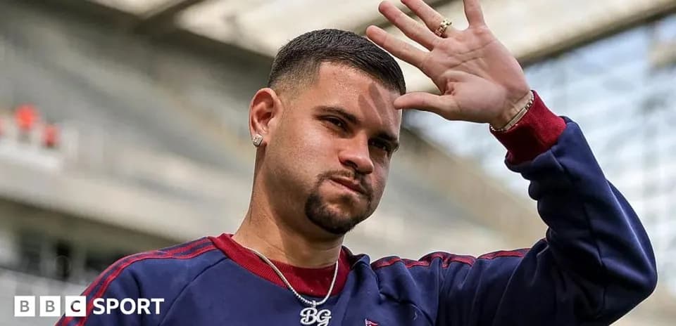 Player waving during training session at stadium