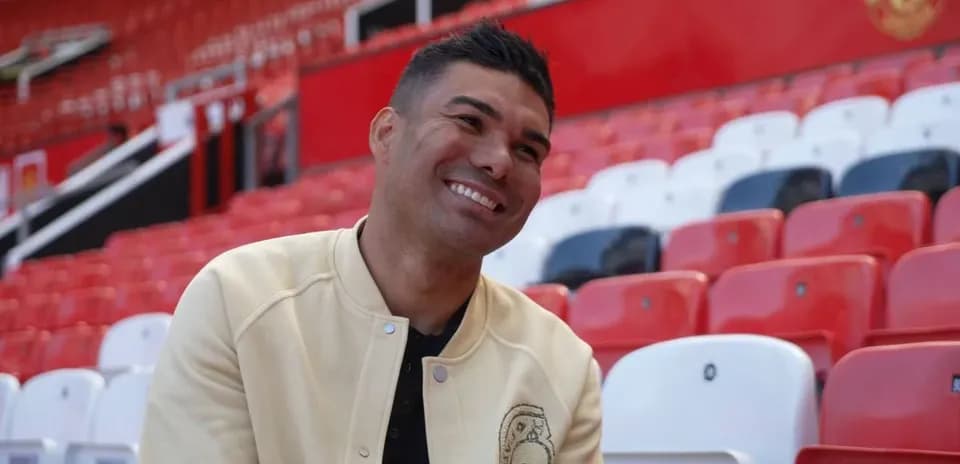 Player smiling in empty stadium seats