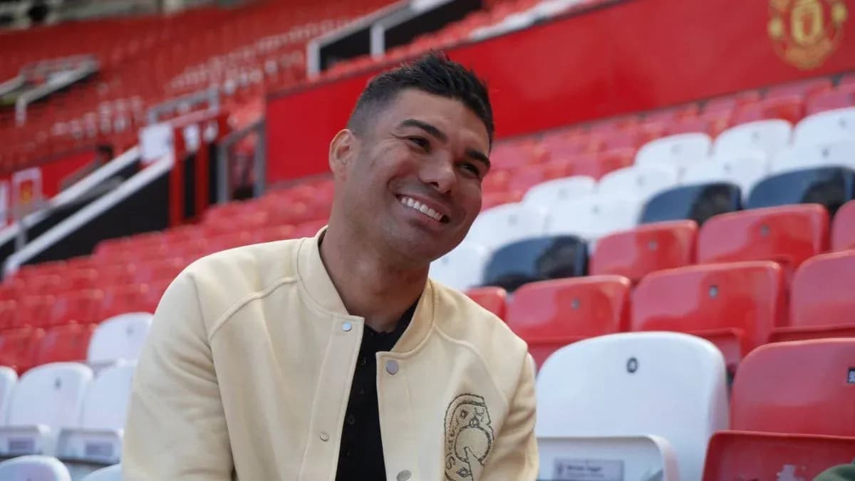Player smiling in empty stadium seats