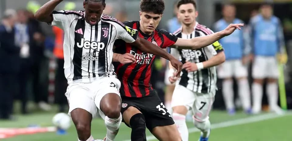 Juventus and AC Milan players contesting for the ball
