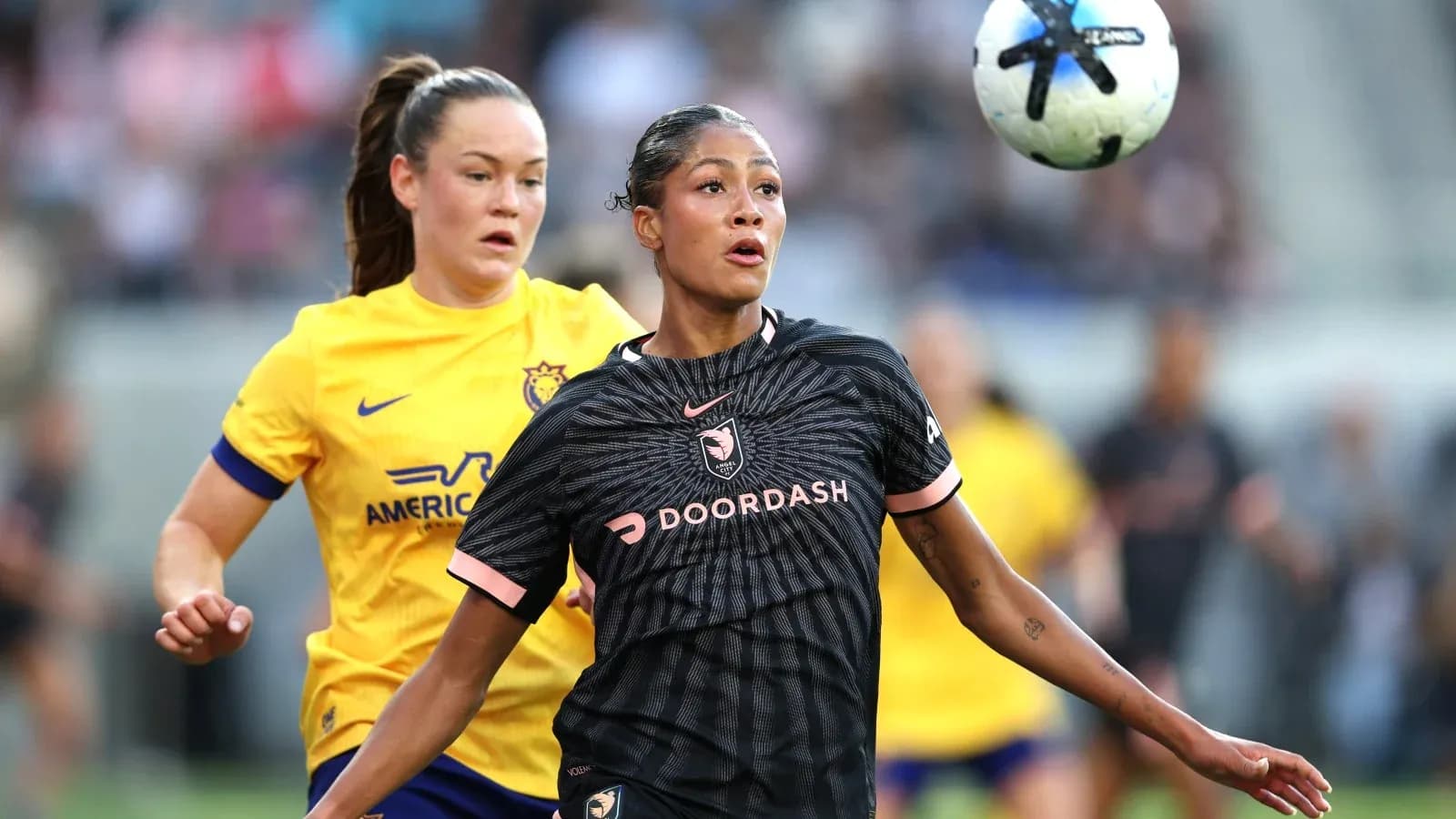 Angel City player controls the ball during match