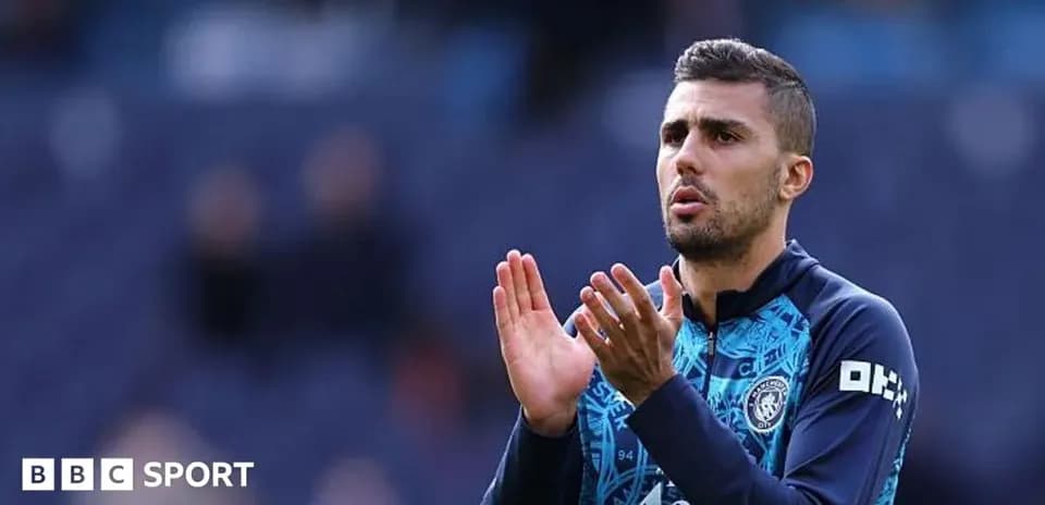 Player applauding during warm-up on the pitch
