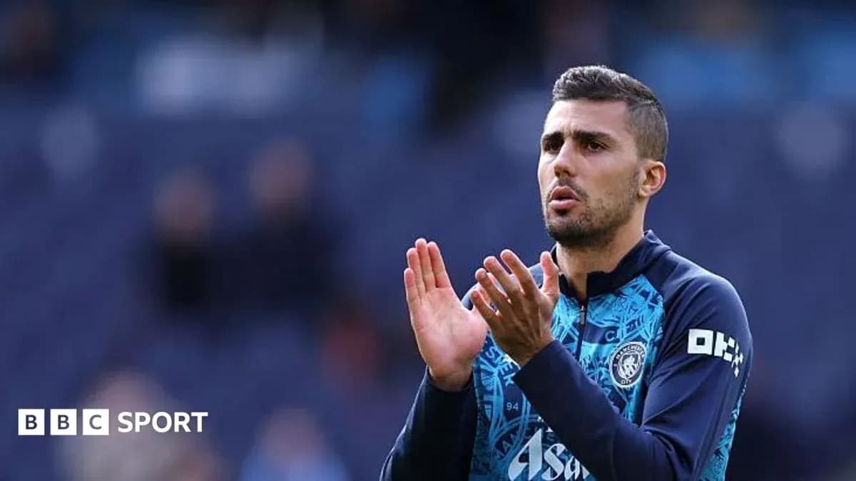 Player applauding during warm-up on the pitch