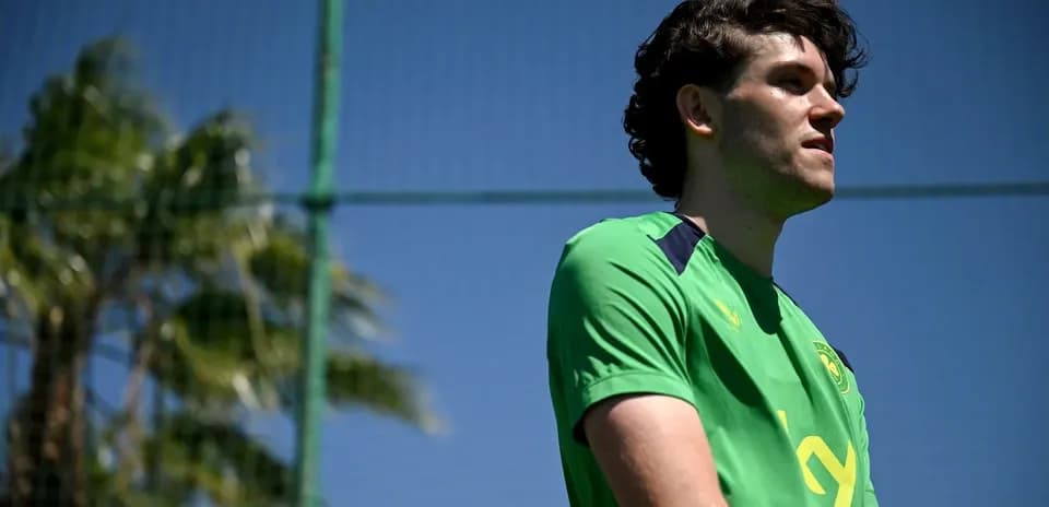 Player in green kit during training session
