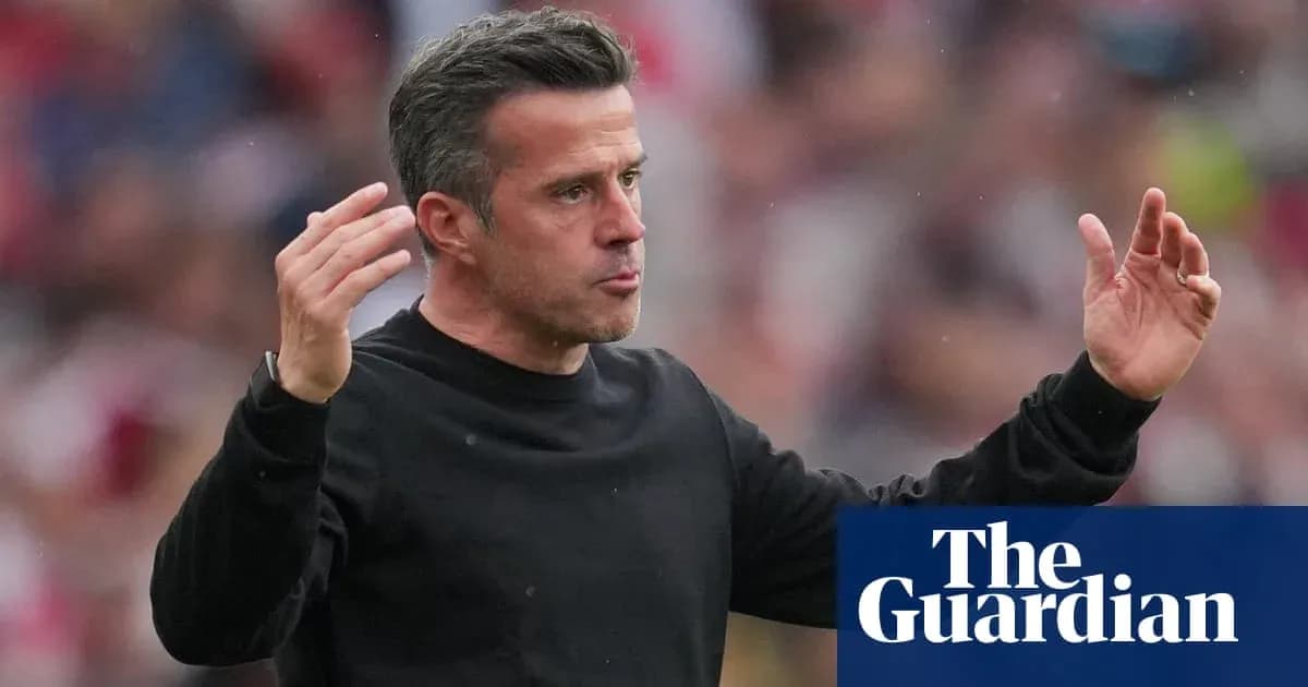 Manager gesturing during match on the sidelines