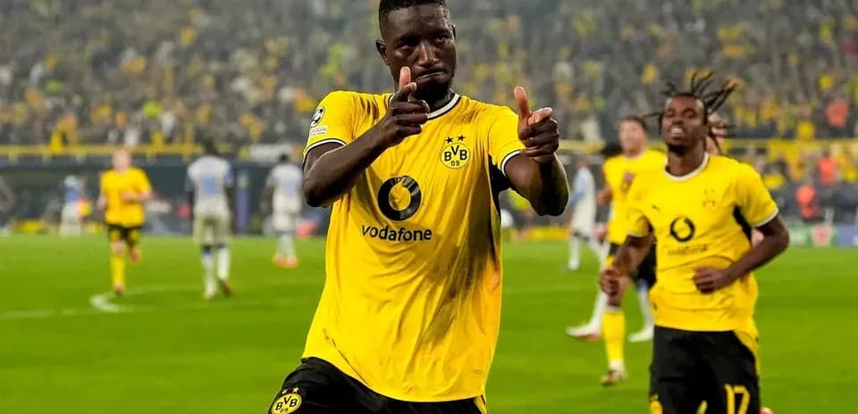 Player celebrating goal in Borussia Dortmund kit