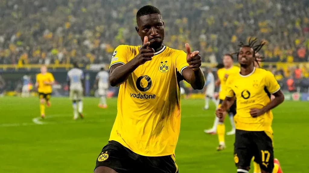 Player celebrating goal in Borussia Dortmund kit