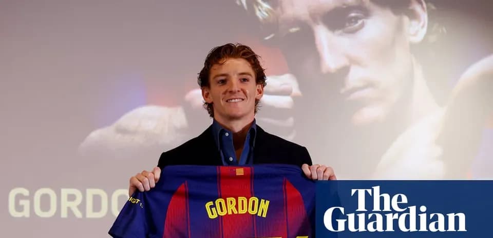 Player holding FC Barcelona jersey during presentation