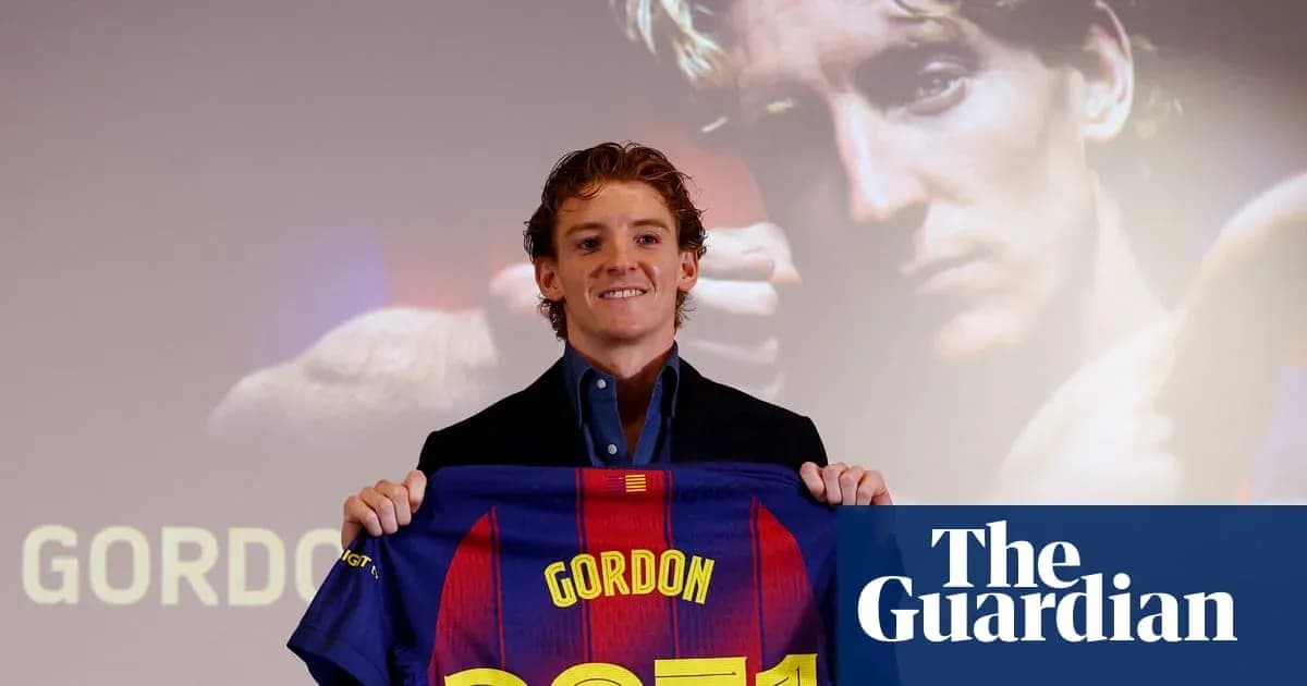 Player holding FC Barcelona jersey during presentation