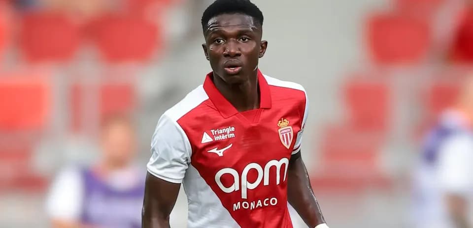 Monaco player in red and white jersey on field
