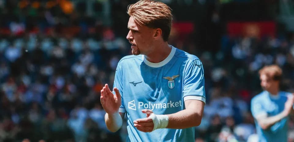 Lazio player applauding fans during a match