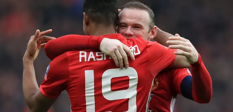 Rashford and Rooney celebrating a goal together
