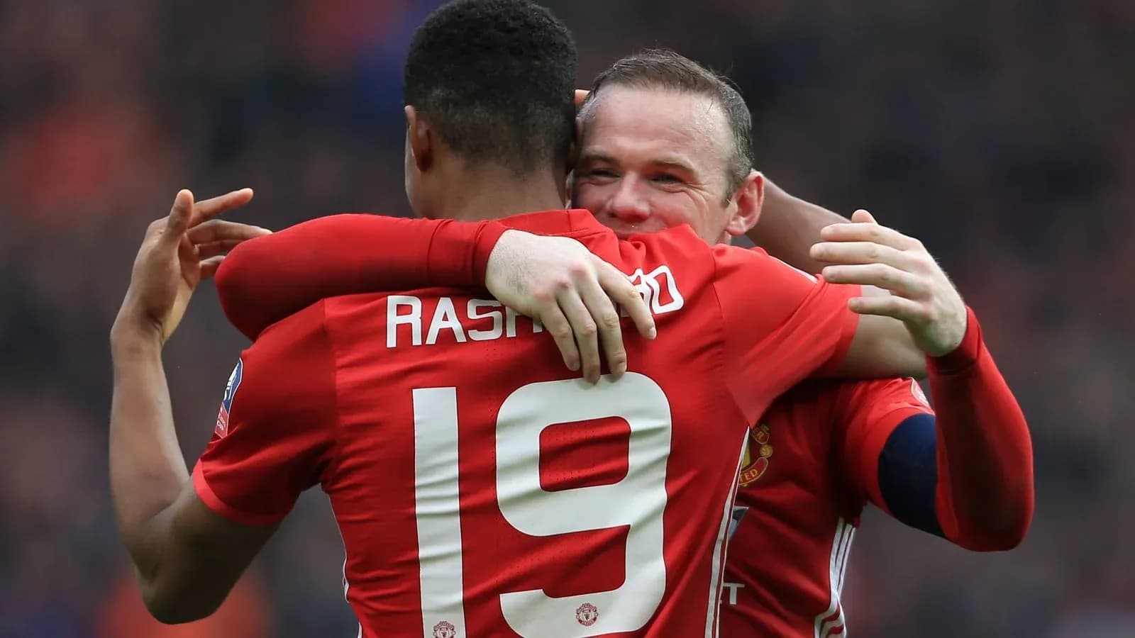 Rashford and Rooney celebrating a goal together
