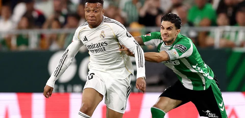Player dribbling while being challenged by opponent