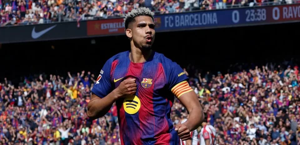 Player celebrating a goal at Barcelona stadium