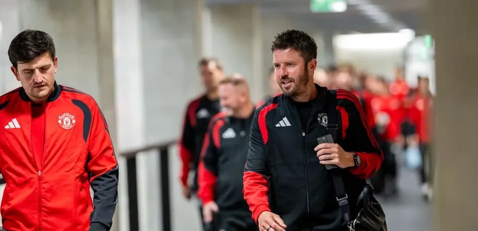 Manchester United team entering stadium corridor