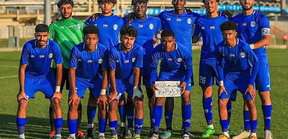Ajman U23 team posing for a photo