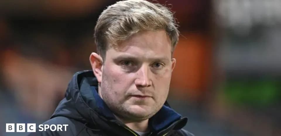 Coach looking serious on the sidelines