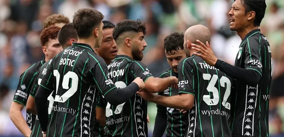 Players celebrating a goal in team huddle