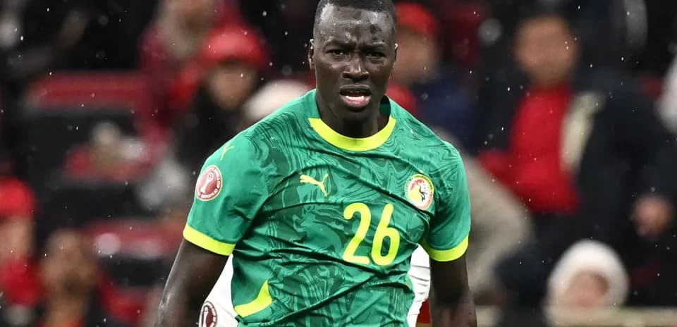 Player in green jersey during a football match