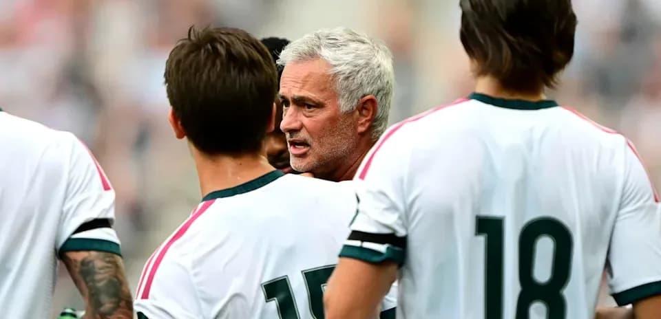 Coach discussing strategy with players during match