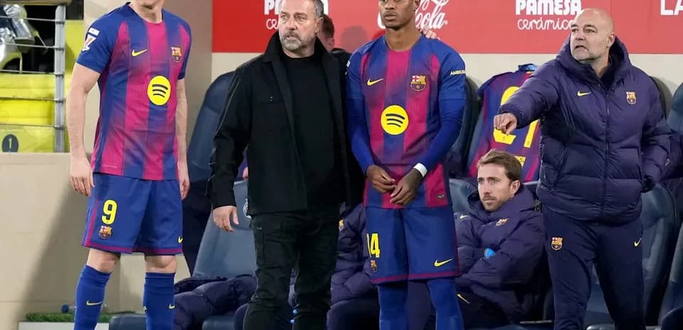 Barcelona players and staff on the sidelines during match