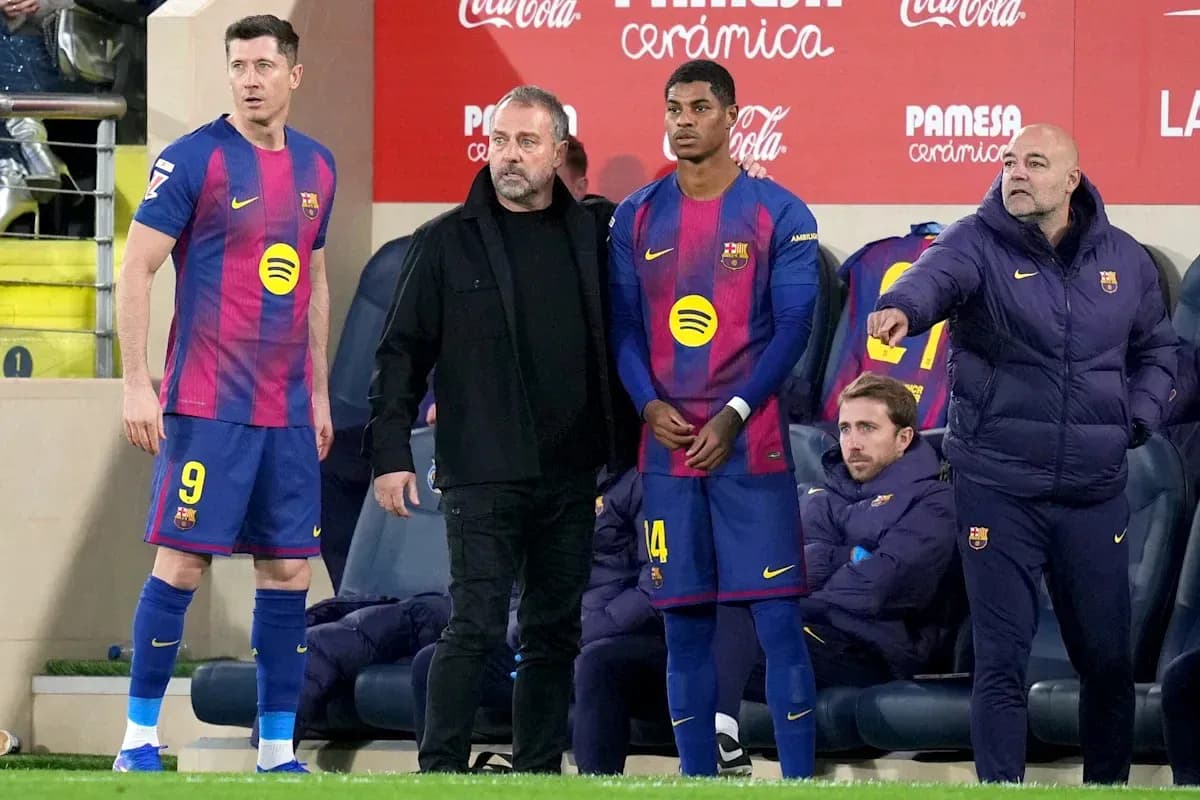 Barcelona players and staff on the sidelines during match
