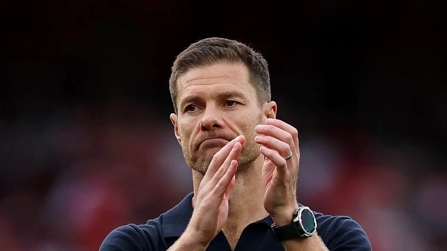 Coach applauding during match at the stadium
