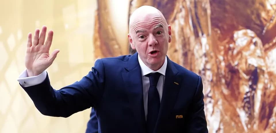FIFA official waving during a public appearance
