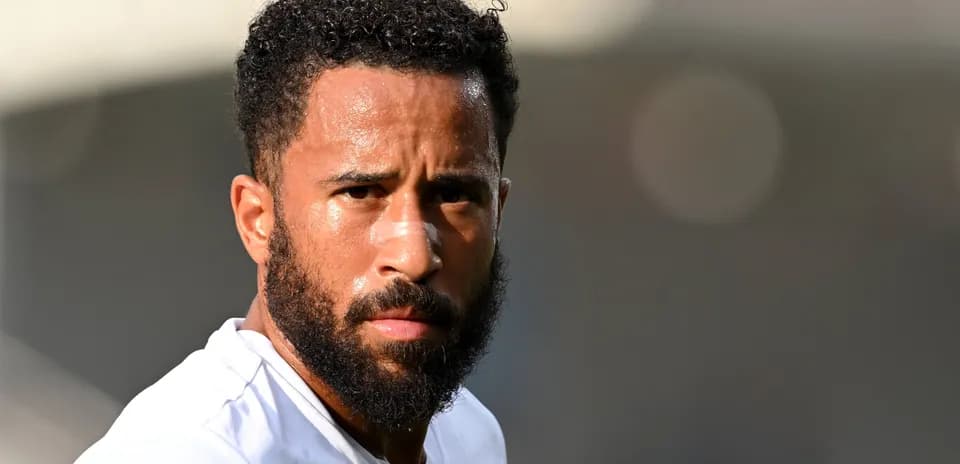 Player with beard and bandage on nose looking forward