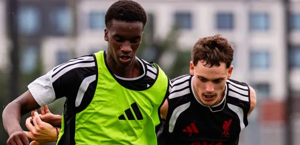 Two players competing for possession during training session