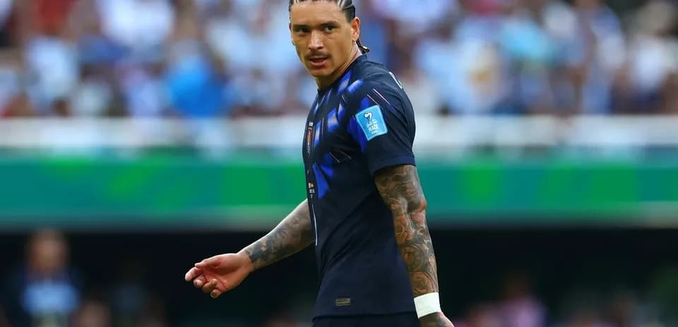 Player in dark jersey during match action