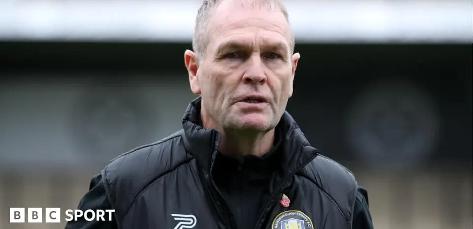 Manager speaking during training session at stadium