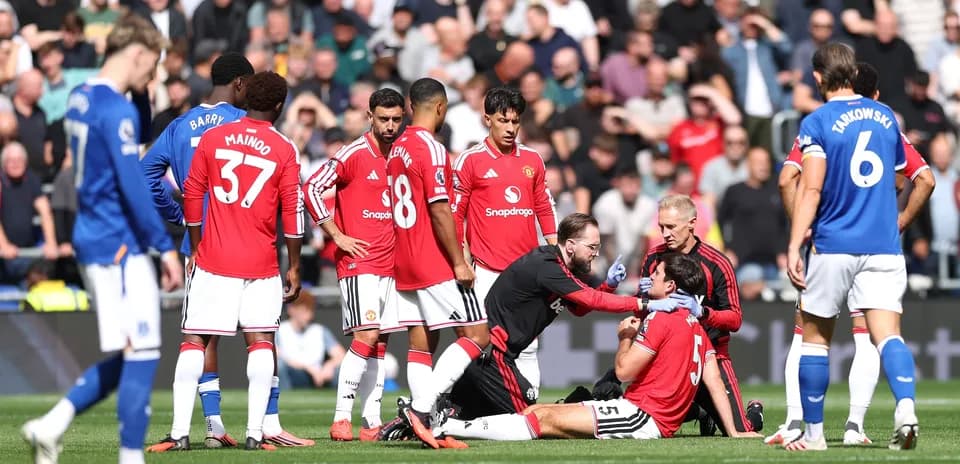 Medical staff attending to injured player on field