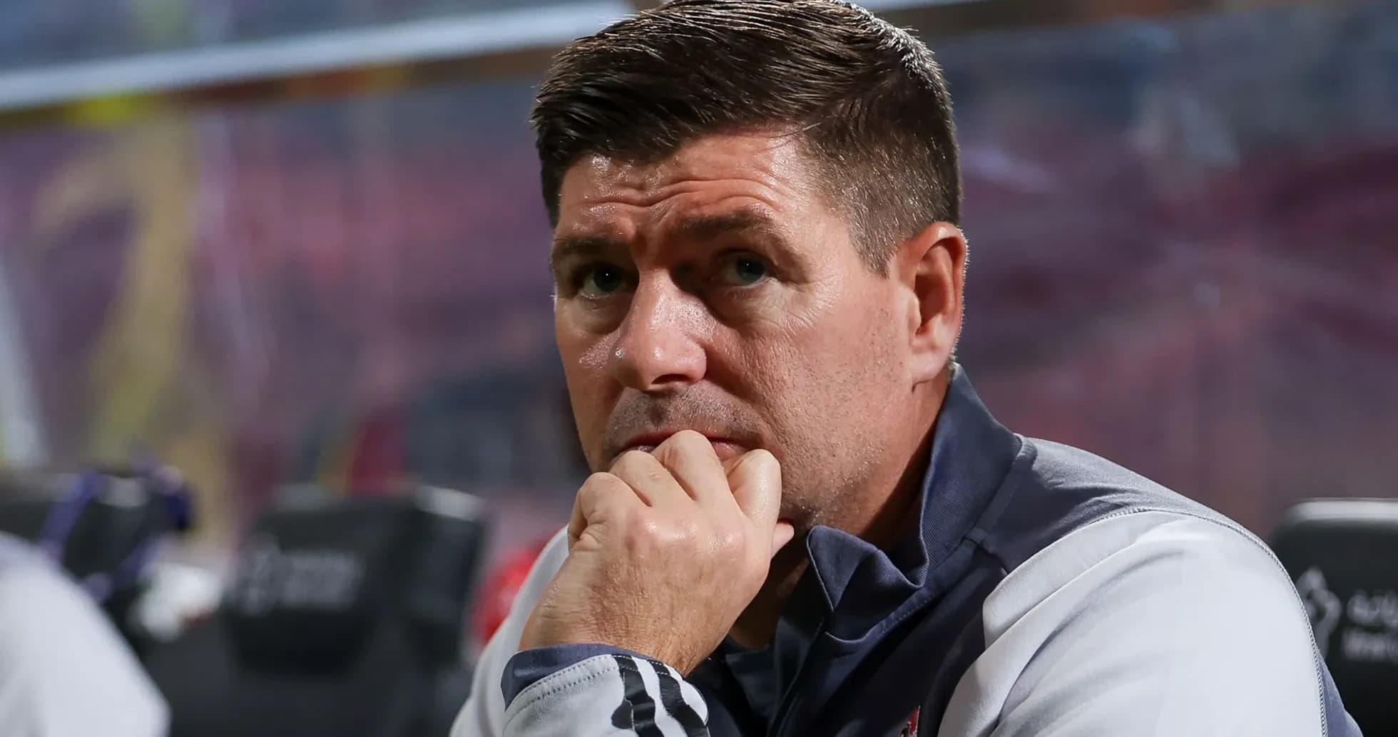 Coach observing match from the sidelines