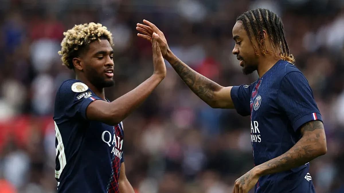 Two PSG players celebrating with a high five