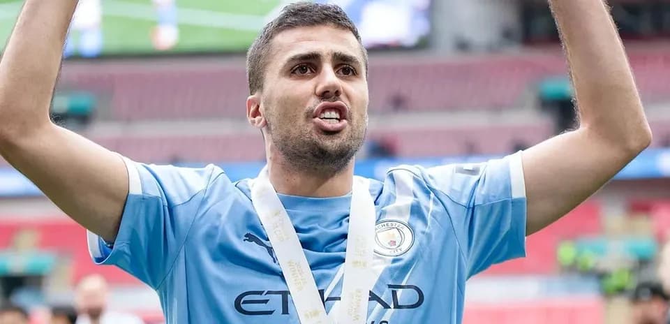 Player celebrating with arms raised after victory