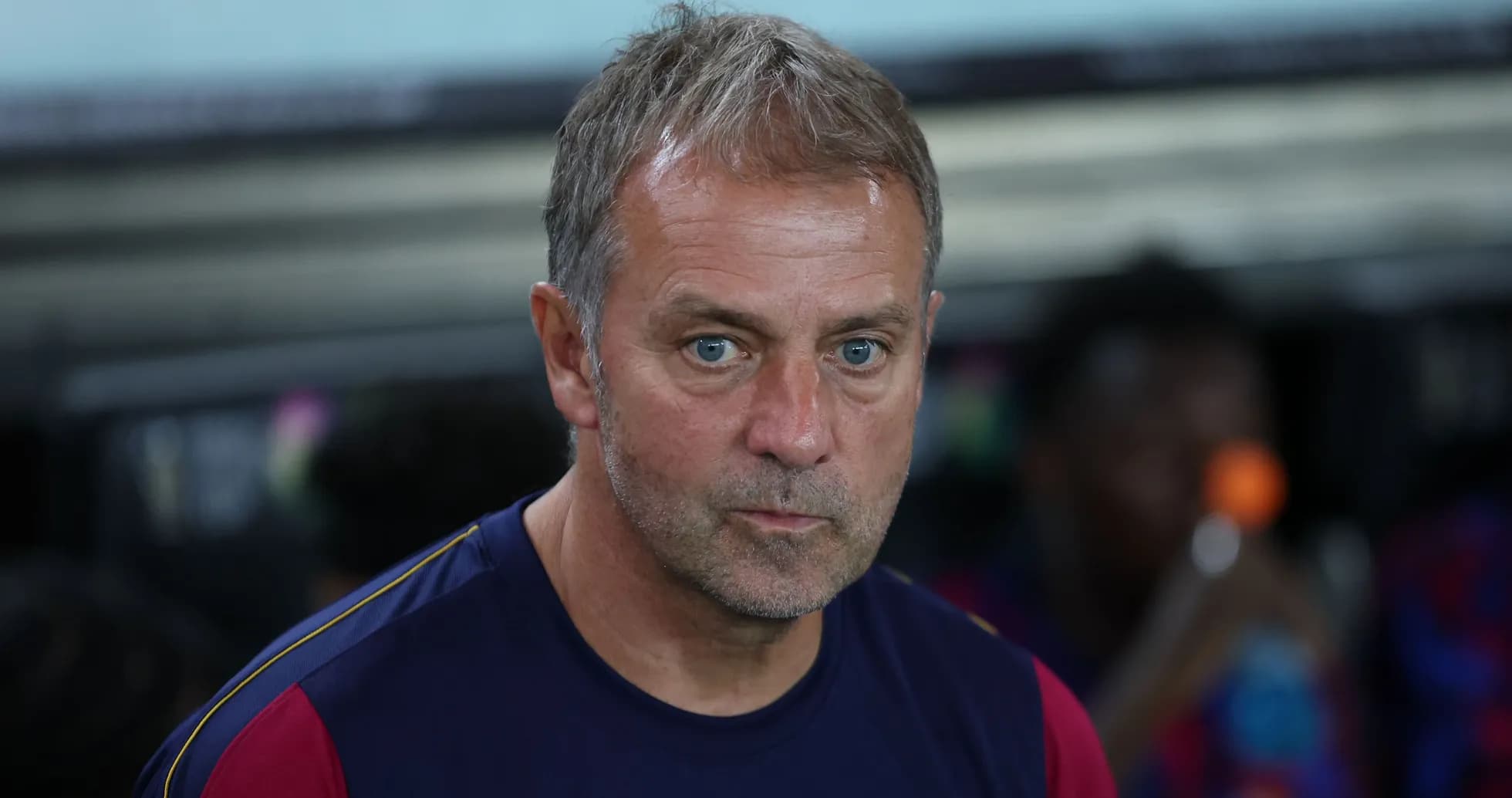 Coach sitting on bench during a match