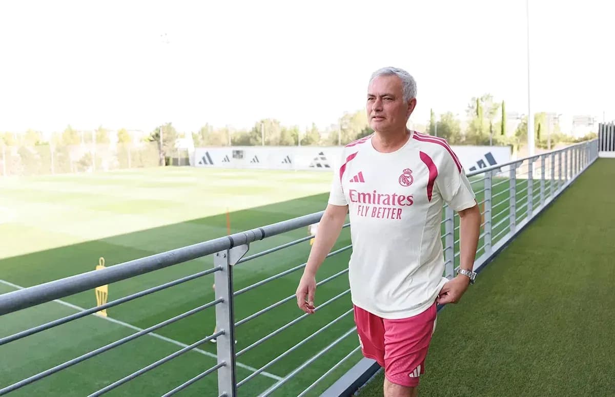 Coach walking on training pitch at Real Madrid
