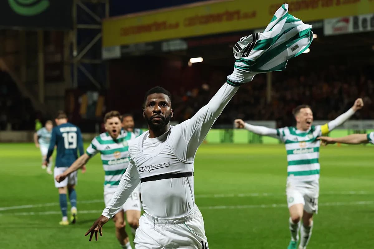 Player celebrating with jersey after scoring goal