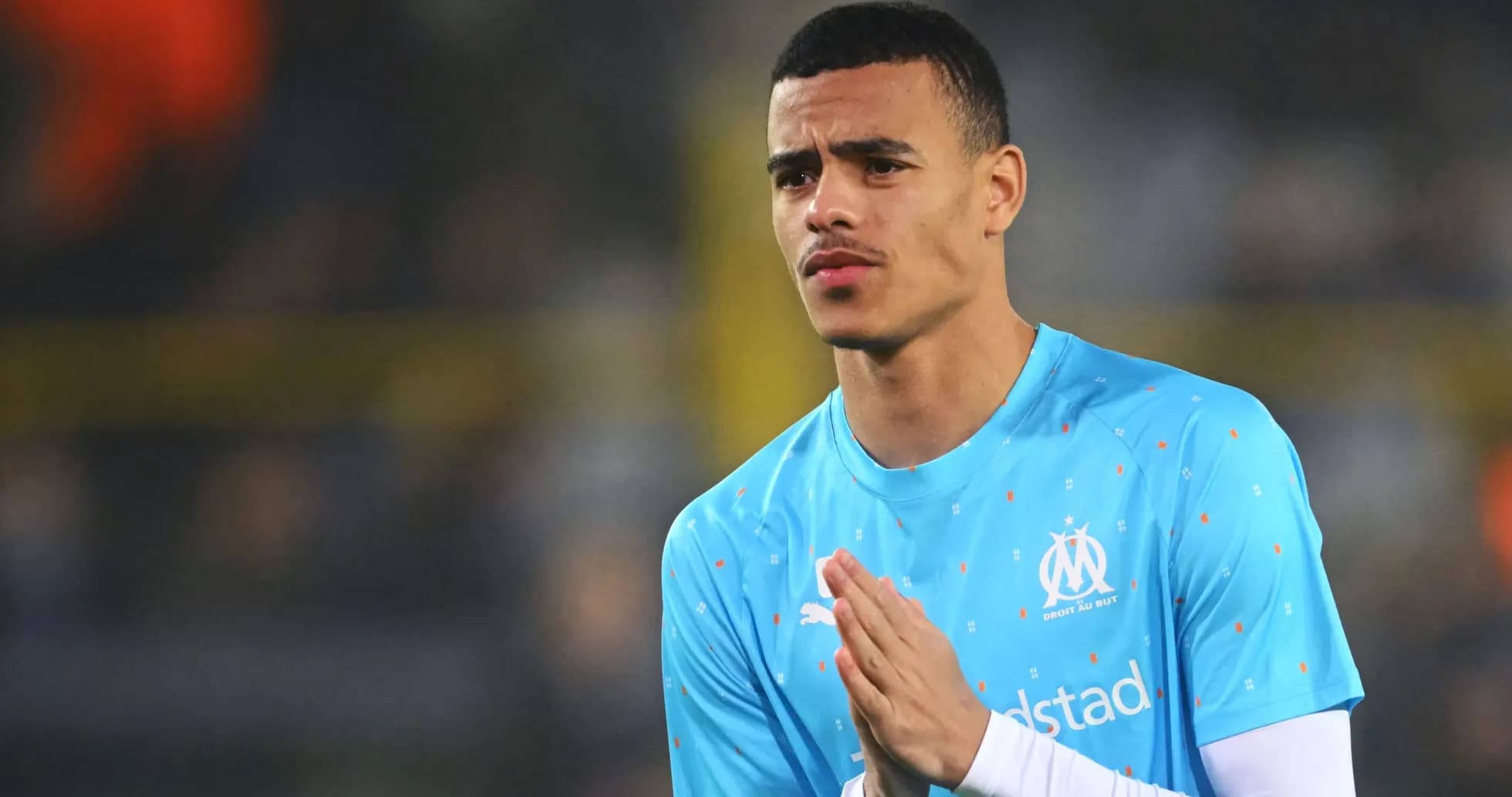 Player warming up in Marseille training kit