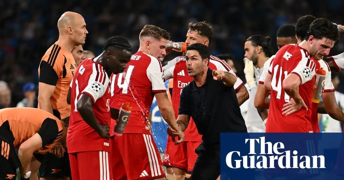 Arsenal players receiving instructions from the coach