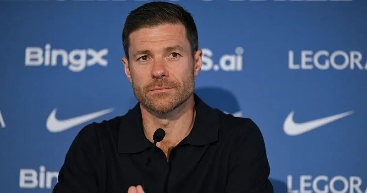 Manager speaking at press conference with microphone