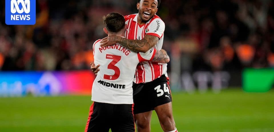 Two players celebrating an achievement on the field