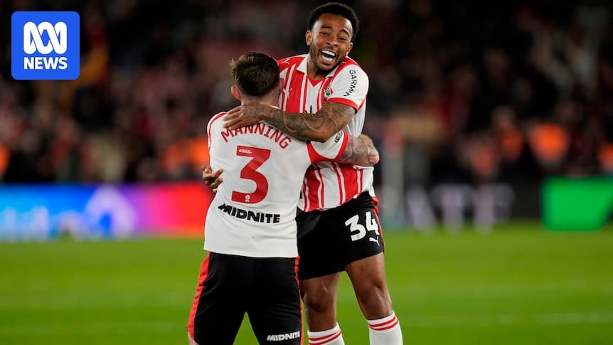 Two players celebrating an achievement on the field