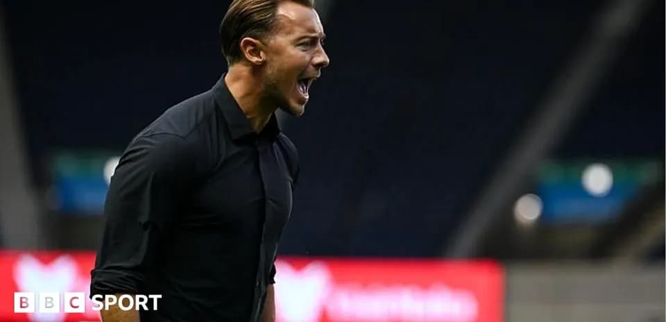 Coach shouting during a football match on the sidelines
