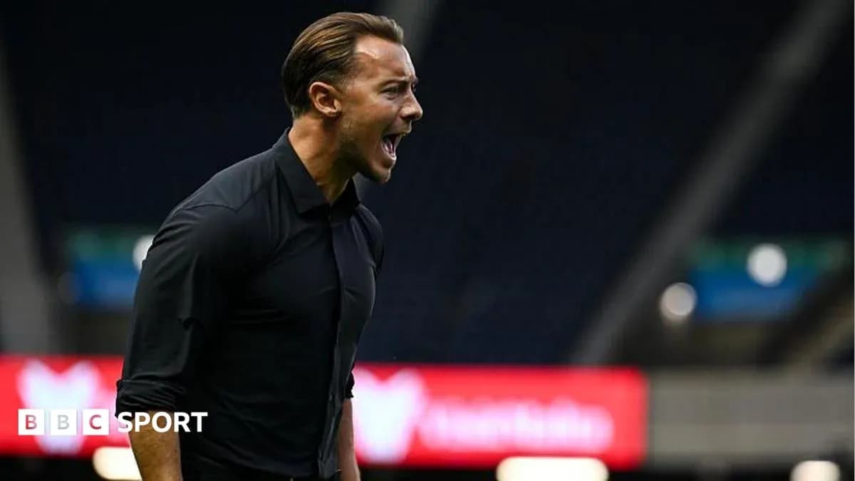 Coach shouting during a football match on the sidelines