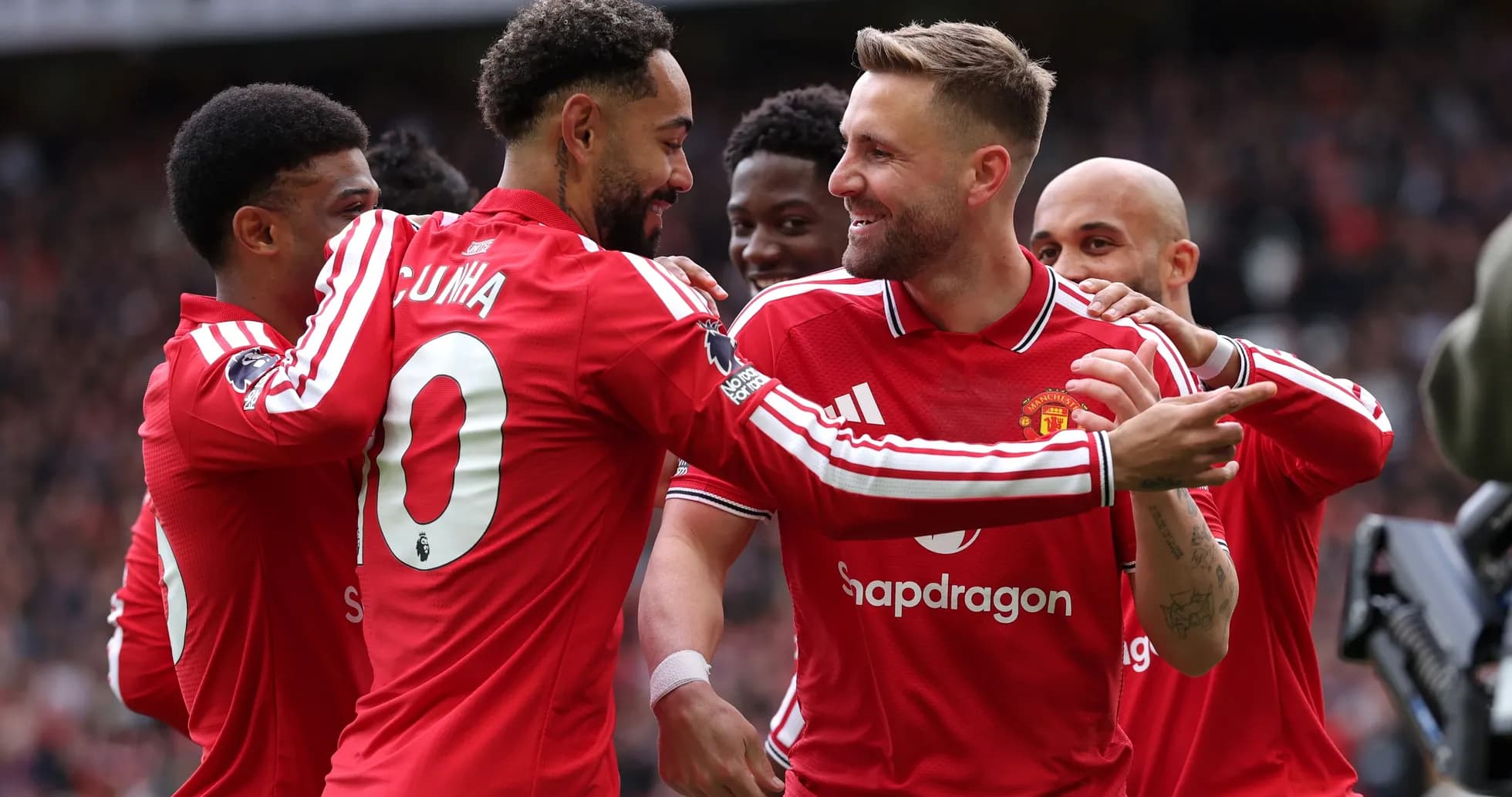 Manchester United players celebrating a goal together